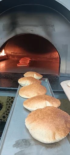 Fresh manakeesh baking at Tripolis Sweets